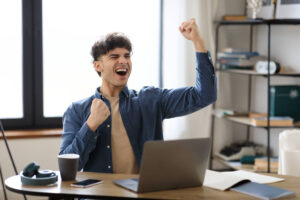 A young man rejoicing because of his passive income.
