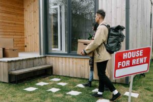 A couple moving into a house for rent.