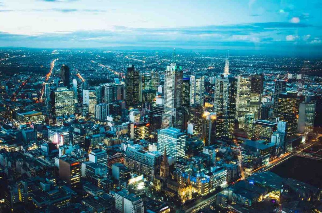 An aerial shot of buildings in Melbourne to signify the local economy.
