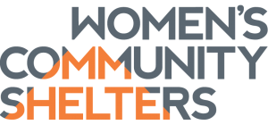 Logo with the words Womens Community Shelters in uppercase letters, with Community and Shelters in orange and gray, and Womens in gray.