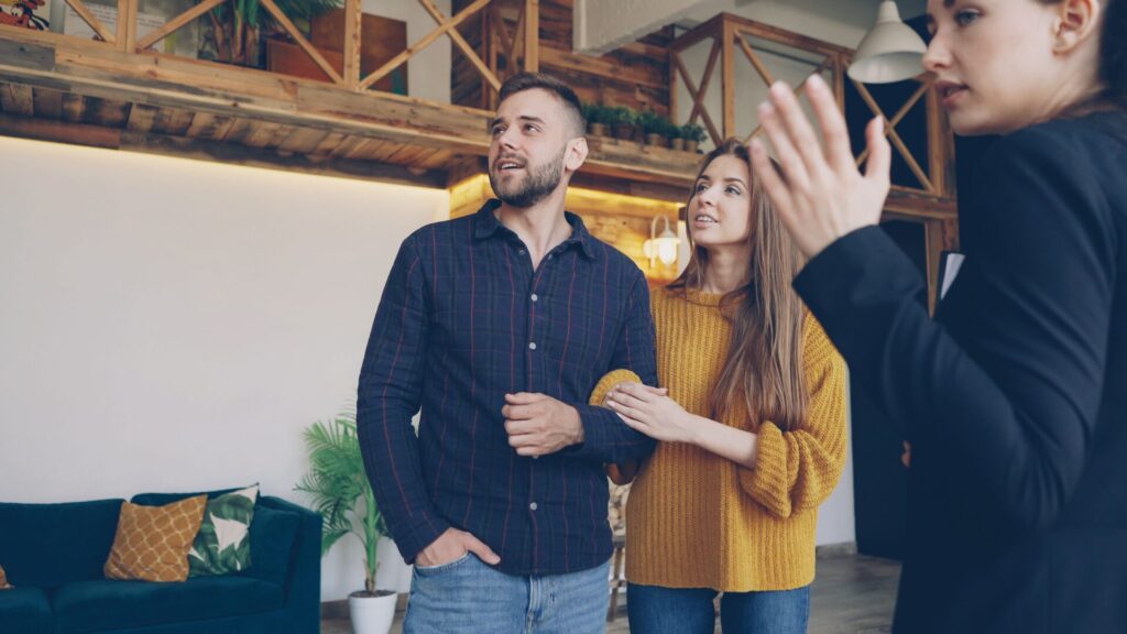 Investors inspecting a co-living property with a real estate agent during a bank valuation.